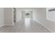 Bright, open-concept living space with tile flooring and sliding glass doors at 849 Teton St, Haines City, FL 33844