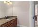 Bathroom vanity with granite countertops, undermount sink, and a view of the doorway at 8625 Brixford St, Orlando, FL 32836