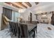 Spacious dining area with marble floors, chandelier, and view into the living room at 8625 Brixford St, Orlando, FL 32836