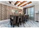 Elegant dining room boasts marble floors, stylish chairs, and a modern chandelier at 8625 Brixford St, Orlando, FL 32836