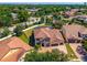 Beautiful home featuring a tile roof, manicured lawn, three car garage, and gorgeous landscaping at 8625 Brixford St, Orlando, FL 32836
