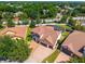 Stunning home featuring a tile roof, manicured lawn, three car garage, and gorgeous landscaping at 8625 Brixford St, Orlando, FL 32836