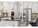 Close-up showcasing kitchen with stainless steel refrigerator and built-in oven at 8625 Brixford St, Orlando, FL 32836