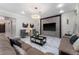 Comfortable living room with marble floors, modern furnishings, and a large television at 8625 Brixford St, Orlando, FL 32836