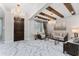 Elegant living room with marble floors, high ceilings with wood beams, and designer lighting at 8625 Brixford St, Orlando, FL 32836