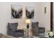 Stylish living room sitting area with modern art and comfortable armchairs at 8625 Brixford St, Orlando, FL 32836