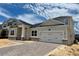 Charming two-story home with a two-car garage, beautiful stone accents, and brick paver driveway at 873 Pointe Emerson Blvd, Apopka, FL 32703