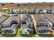 Aerial view of a neighborhood with screened-in pools at 9179 Sommerset Hills Dr, Davenport, FL 33896