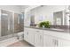 Bright bathroom with double vanity, glass shower, and lots of natural light at 9179 Sommerset Hills Dr, Davenport, FL 33896
