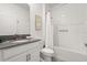 Bathroom featuring a vanity with a sink and a shower with white tile at 9179 Sommerset Hills Dr, Davenport, FL 33896