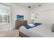 Comfortable bedroom with carpet floors, a queen bed, and tv at 9179 Sommerset Hills Dr, Davenport, FL 33896