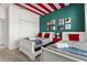 A bright bedroom with colorful accents and two beds for guests at 9179 Sommerset Hills Dr, Davenport, FL 33896