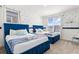 Cozy bedroom with two beds, natural light from two windows, and calming color scheme at 9179 Sommerset Hills Dr, Davenport, FL 33896