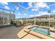 Close-up of relaxing hot tub with screen enclosure at 9179 Sommerset Hills Dr, Davenport, FL 33896