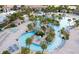 Aerial view of a lazy river with lush landscaping, lounge chairs, and ample space to relax at 9179 Sommerset Hills Dr, Davenport, FL 33896