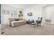 Bright living room features comfortable sofa, stylish decor, and natural light, perfect for relaxation and entertainment at 9179 Sommerset Hills Dr, Davenport, FL 33896