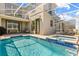 Outdoor living with a refreshing pool and spa at 9179 Sommerset Hills Dr, Davenport, FL 33896