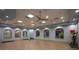 Yoga room with wood floors, mirrors, and natural light at 9179 Sommerset Hills Dr, Davenport, FL 33896