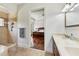 A gorgeous bathroom featuring dual sinks and a glass door shower at 9684 Sweetleaf St, Orlando, FL 32827