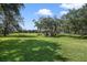 Expansive community park features green space, mature trees, and a covered picnic area for residents to enjoy at 9684 Sweetleaf St, Orlando, FL 32827