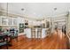 Well-equipped kitchen with granite countertops, stainless steel appliances, and custom white cabinetry at 9684 Sweetleaf St, Orlando, FL 32827