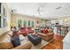 Inviting living room and kitchen featuring hardwood floors, with a smooth transition, and neutral paint at 9684 Sweetleaf St, Orlando, FL 32827