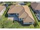 Aerial view of the beautiful home with tile roof and covered back porch at 11025 Ledgement Ln, Windermere, FL 34786