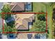 Aerial view of a single-Gathering home with a tile roof and well-kept landscaping at 11025 Ledgement Ln, Windermere, FL 34786