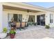Inviting covered porch with ample seating and lush landscape views at 11025 Ledgement Ln, Windermere, FL 34786