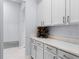 Spacious butler's pantry with white cabinets, countertops, and a wine rack at 11025 Ledgement Ln, Windermere, FL 34786