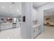 Open-concept kitchen featuring modern stainless steel appliances, white cabinets, and a dining area at 11025 Ledgement Ln, Windermere, FL 34786
