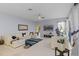 Spacious living room with large windows, neutral tones, and modern decor at 11025 Ledgement Ln, Windermere, FL 34786