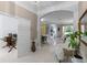 Elegant living space with gleaming tile floors, open layout, and easy access to office and dining areas at 11025 Ledgement Ln, Windermere, FL 34786