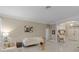 Inviting living area featuring sleek tile floors, modern decor, and seamless flow to dining and entry at 11025 Ledgement Ln, Windermere, FL 34786