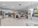 Open-concept kitchen and living area with modern appliances, sleek cabinetry, and plenty of natural light at 11025 Ledgement Ln, Windermere, FL 34786