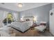 Main bedroom with a king bed, chandelier, and access to a patio at 11025 Ledgement Ln, Windermere, FL 34786