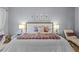 Comfortable primary bedroom featuring a cozy chaise lounge and inviting neutral decor at 11025 Ledgement Ln, Windermere, FL 34786