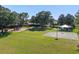 A park view featuring a playground, basketball court, gazebo, and grassy field at 11025 Ledgement Ln, Windermere, FL 34786