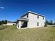This home includes a well-maintained lawn, covered patio, and easy access to the backyard at 1116 Myrtle Hammock Ln, Davenport, FL 33837