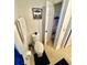 Small half bathroom with tile floor, a white towel rack, and an opened door to a closet for storage at 1116 Myrtle Hammock Ln, Davenport, FL 33837