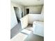 Upstairs hallway featuring carpeting, white walls, and doors leading to other rooms of the house at 1116 Myrtle Hammock Ln, Davenport, FL 33837