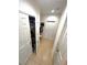 Hallway with tile flooring, access to a pantry, and a door leading outside at 1116 Myrtle Hammock Ln, Davenport, FL 33837