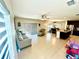 Spacious living room boasts an open concept design with tiled floors and natural light at 1116 Myrtle Hammock Ln, Davenport, FL 33837