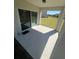 Covered patio features a door with blinds for easy access to the backyard at 1116 Myrtle Hammock Ln, Davenport, FL 33837