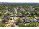 Areal view of neighborhood with mature trees and glimpse of city skyline in background at 1122 Vassar St, Orlando, FL 32804