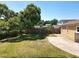 Backyard featuring a well kept lawn and a wooden fence, offering both privacy and charm at 1122 Vassar St, Orlando, FL 32804