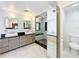 Modern bathroom with dual sinks, granite countertops, and glass-enclosed shower at 1122 Vassar St, Orlando, FL 32804
