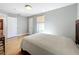 Cozy bedroom featuring hardwood floors, a comfortable bed, and ample natural light at 1122 Vassar St, Orlando, FL 32804