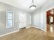 Bright foyer features hardwood floors, ample natural light, and a white front door at 1122 Vassar St, Orlando, FL 32804
