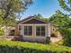 Charming single-story home featuring lush landscaping and well-manicured hedge at 1122 Vassar St, Orlando, FL 32804